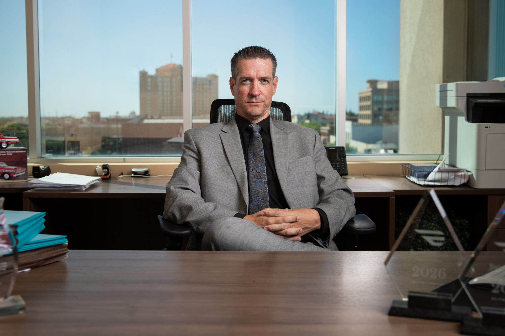 Jared Jordan at his desk in the Modesto law office